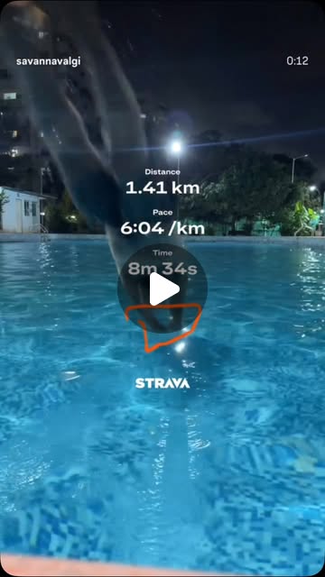 Savan running by a pool at night, Strava overlay showing 1.41 km at 6:04/km pace